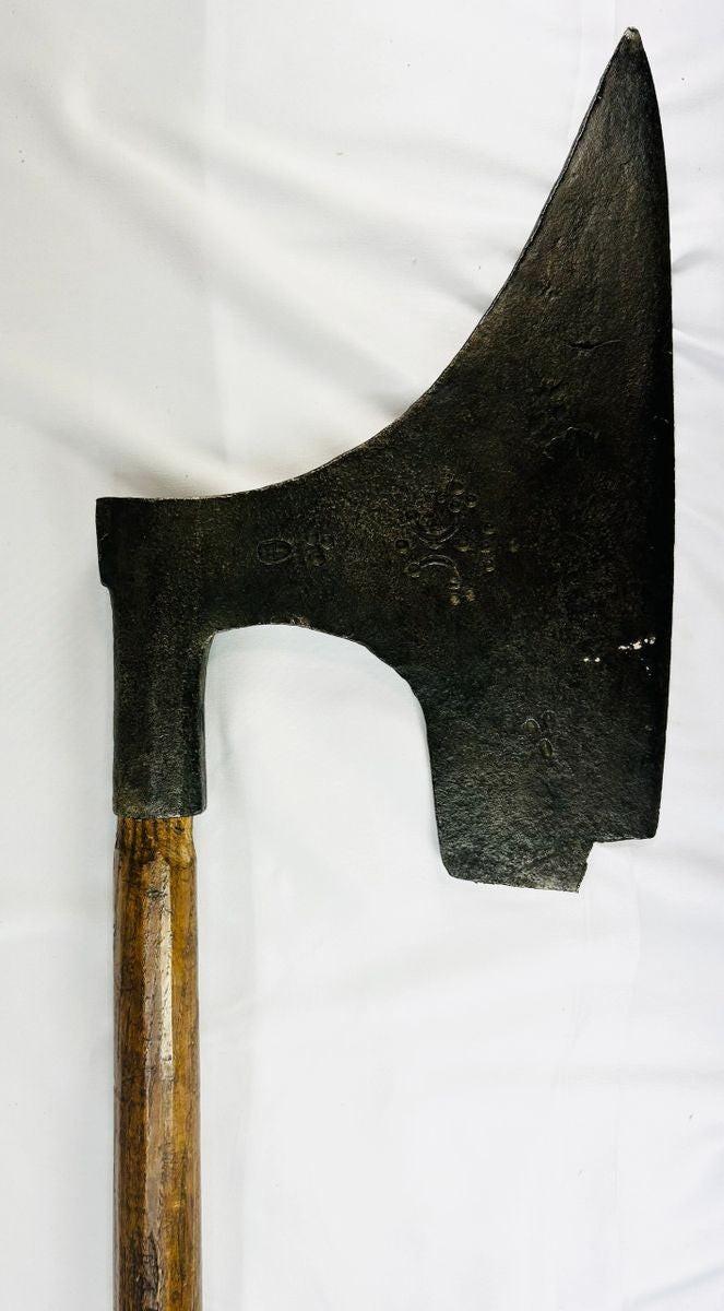 German or Scandinavian executioner-style axe, forged iron with hallmark stamps and rustic patina.