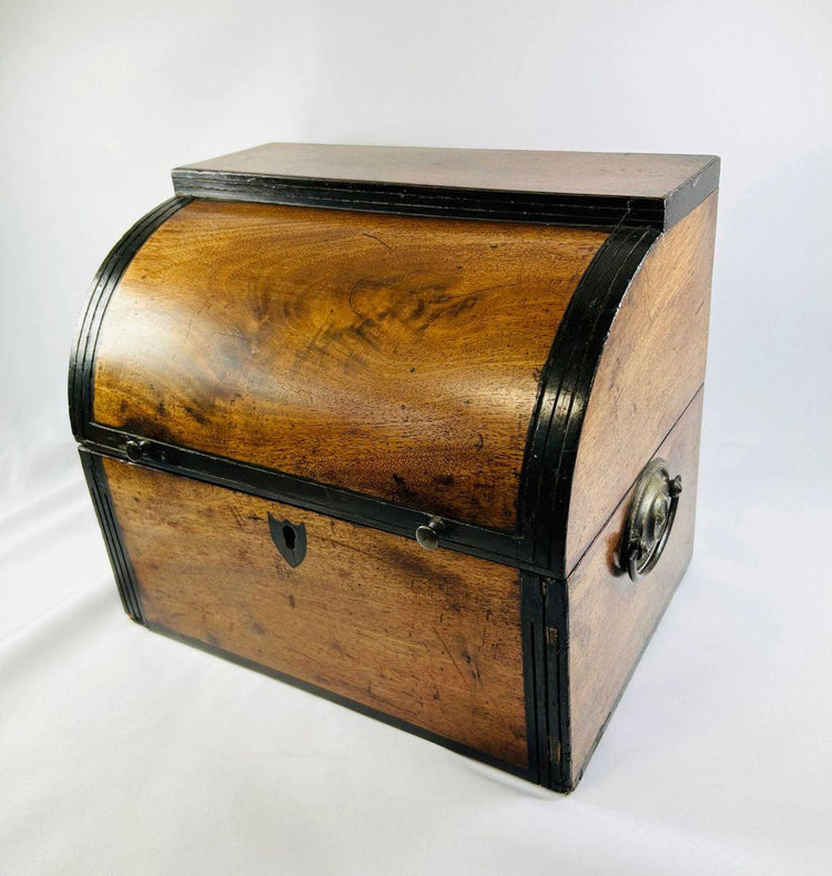 Early Georgian curved-top mahogany spirit box with black trim and keyhole, side-angle view.
