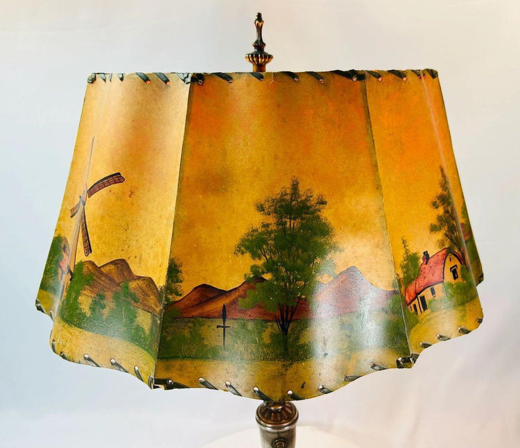 Hand-painted parchment lampshade depicting cottages and windmills on an antique European table lamp