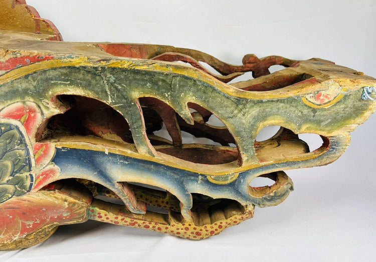 Close-up of Qing Dynasty phoenix relief base section showing intricate openwork carving, red and blue polychrome pigments, and aged camphor wood surface – Relic and Rarity.