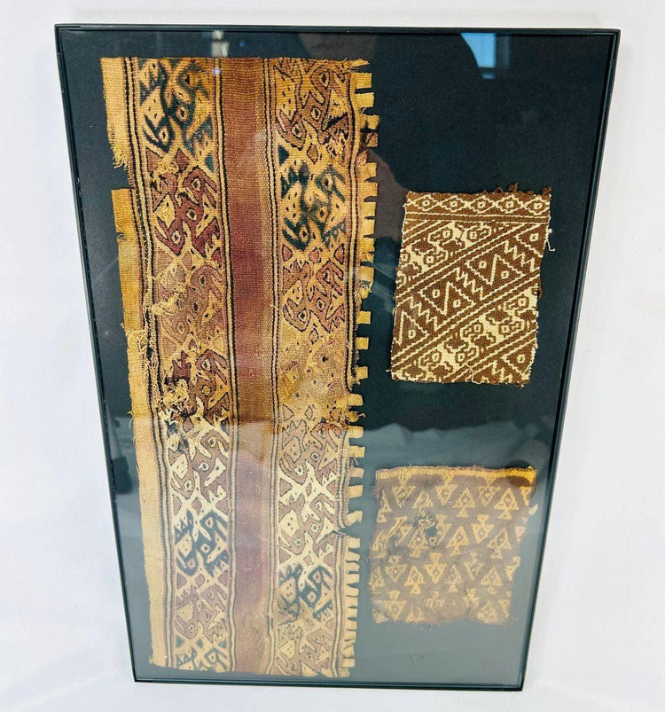 Detail shot of ancient Peruvian textiles showing intricate weaving and natural dye preservation.