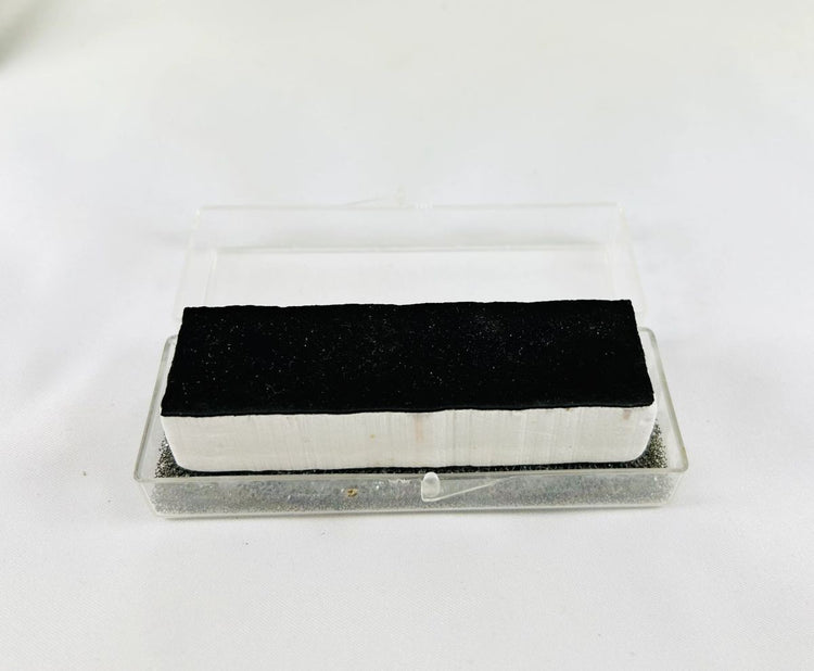 Authentic NASA Space Shuttle HRSI thermal protection tile, 1980s silica-ceramic block with black Reaction Cured Glass coating, used for reentry heat resistance.