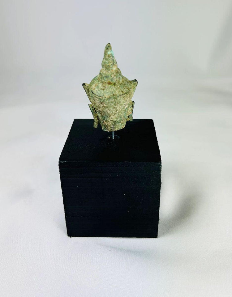 Antique bronze Buddha head elongated earlobes pointed ushnisha green patina