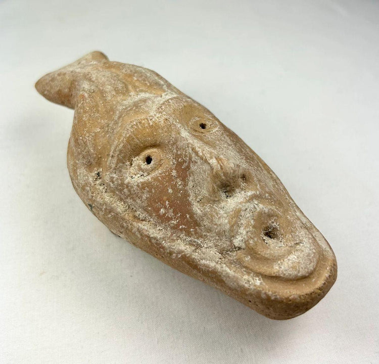 Ancient Byzantine terracotta oil lamp with molded human face spout