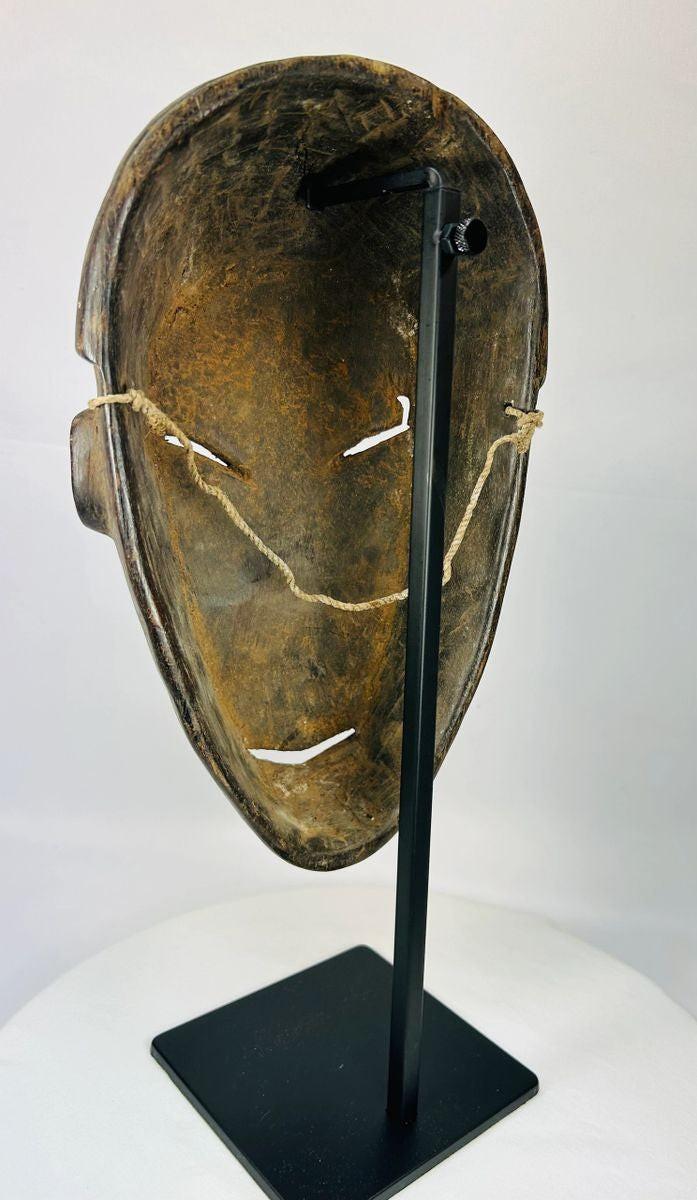 Antique Dan tribal mask from Côte d’Ivoire with carved wood and ritual patina