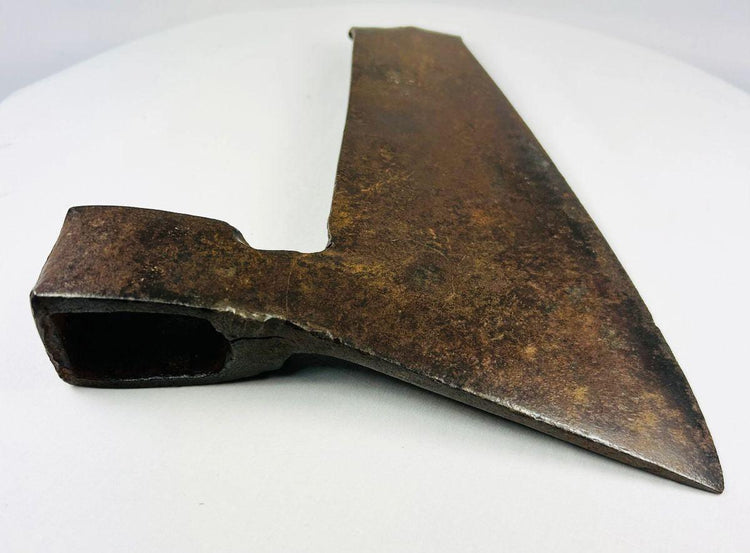 Historic European carpentry axe with elongated goosewing blade, hollow socket, and naturally aged iron surface