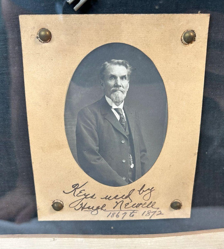 Victorian-era key collection with watchman Hugh Newell portrait