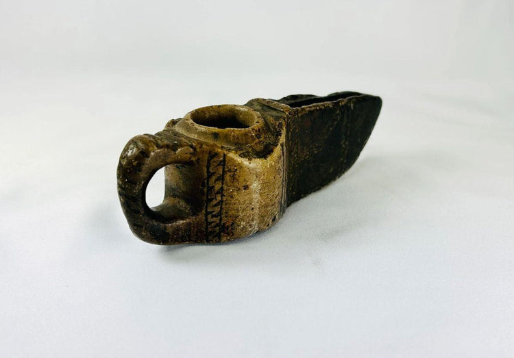 Antique Islamic oil lamp with open spout and natural patina