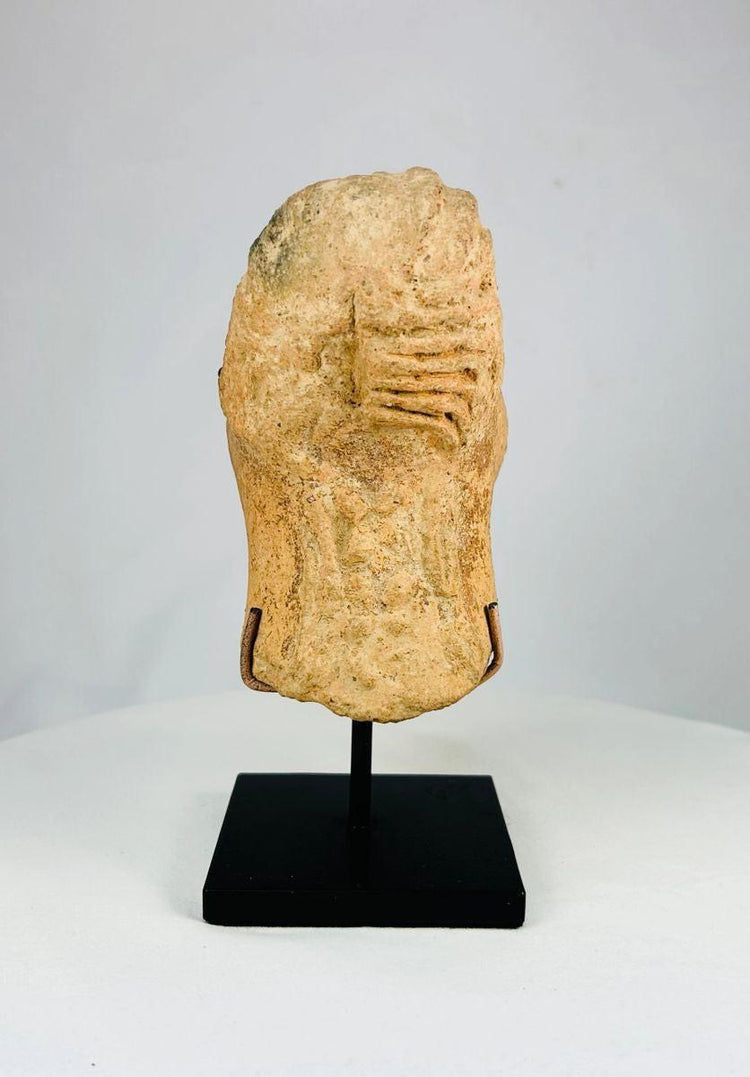 Bura terracotta head with stylized lips flat nose and rear ornamentation