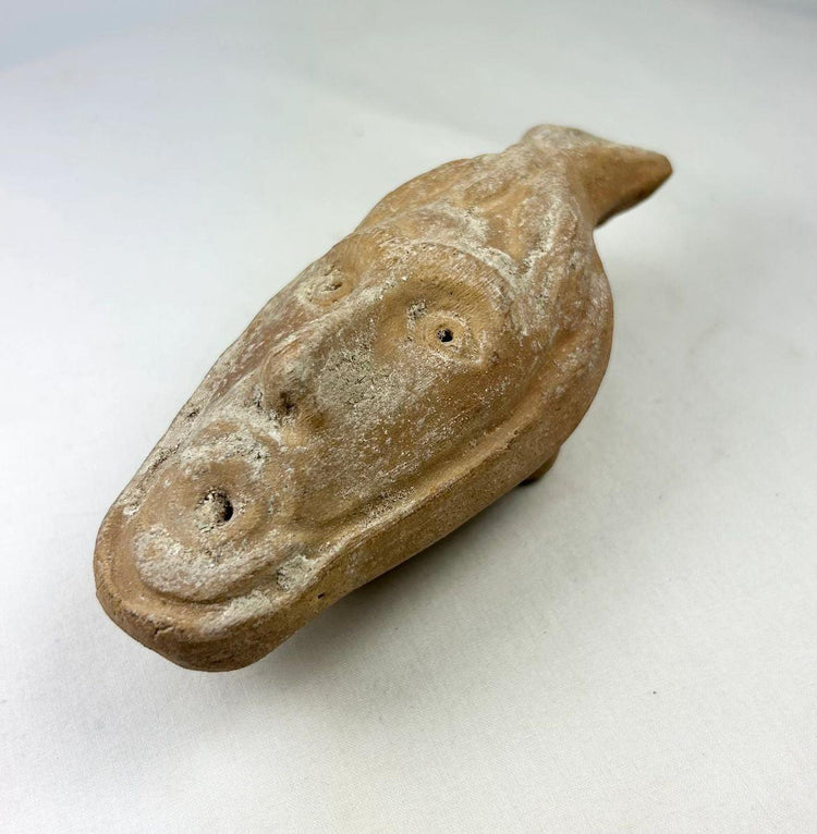 Ancient Byzantine terracotta lamp with detailed human facial spout