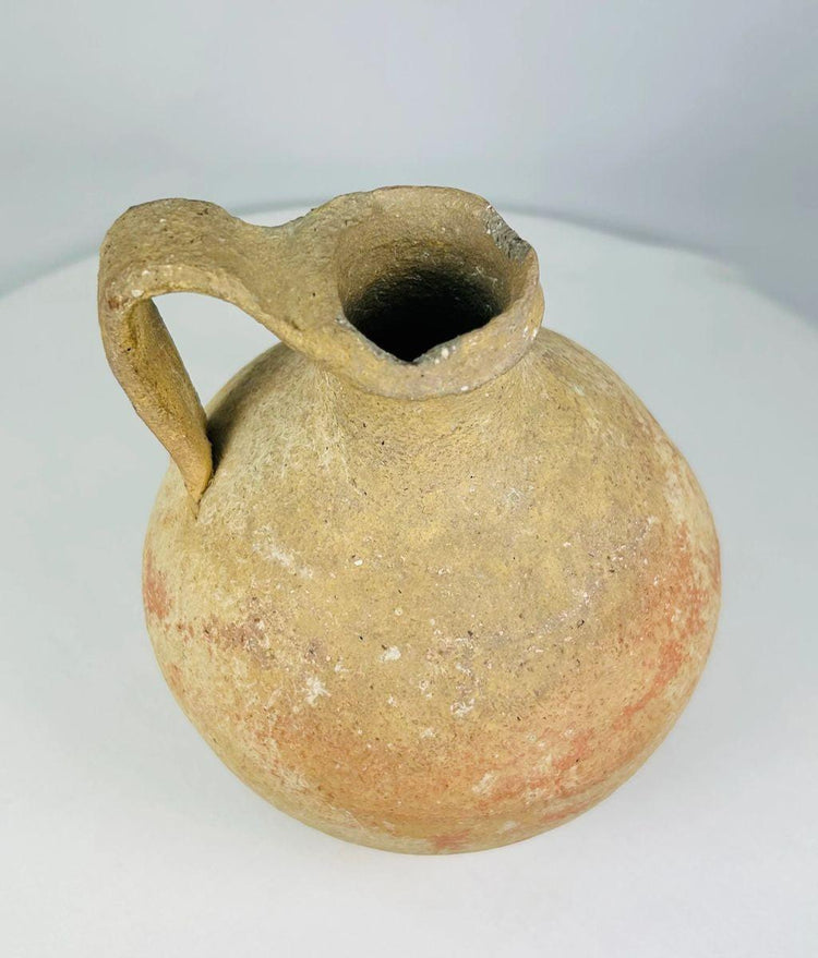 Terracotta jug from Abydos with arched handle and functional design