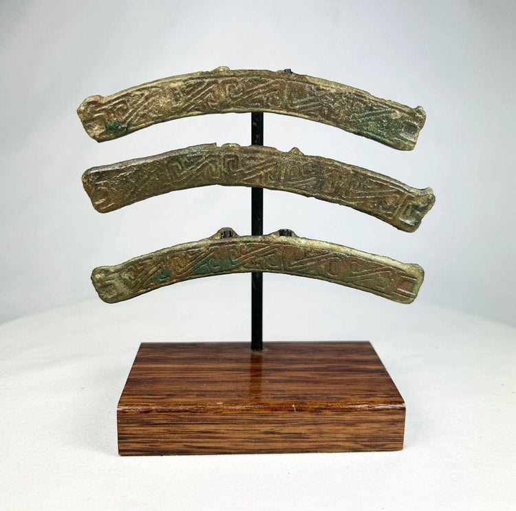 Chinese bronze chariot fittings featuring engraved inscriptions and patina