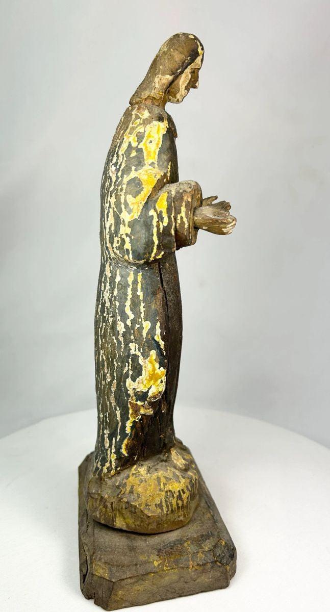 Spanish Colonial santo religious sculpture carved from wood with traces of original gilt and paint