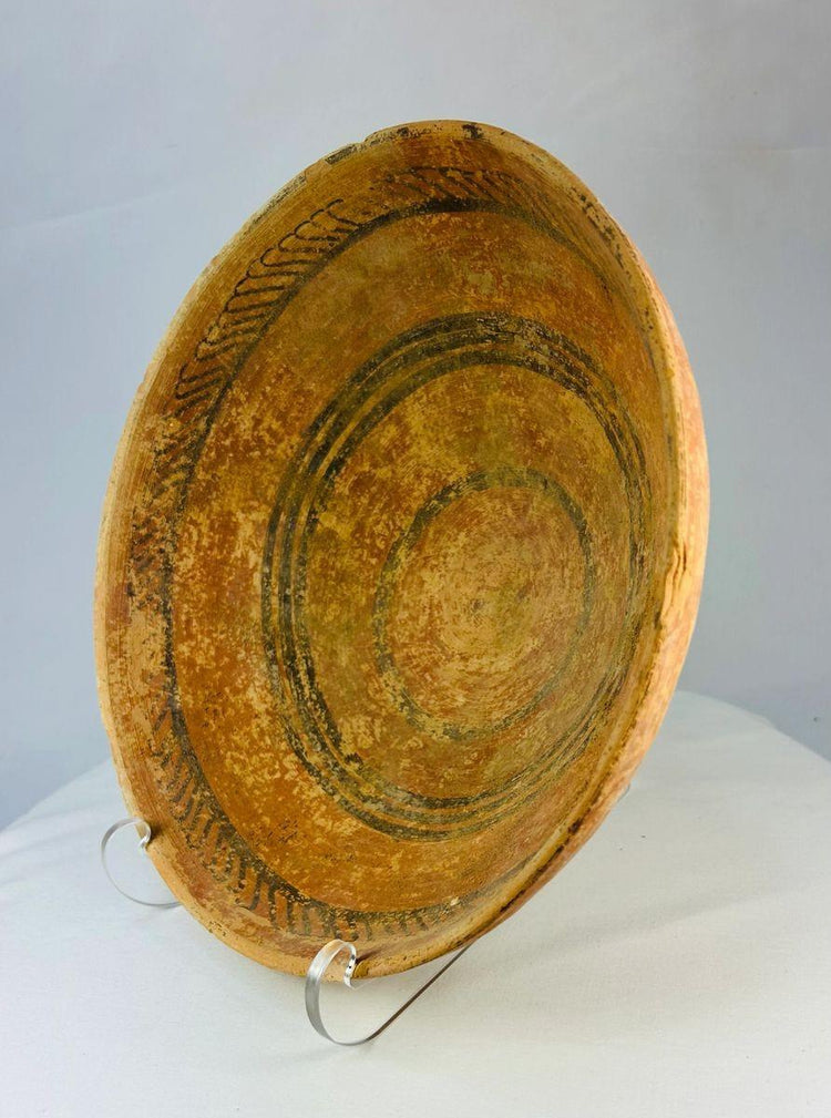 Ancient Indus Valley artifact: painted pottery dish with geometric decoration and balanced form.