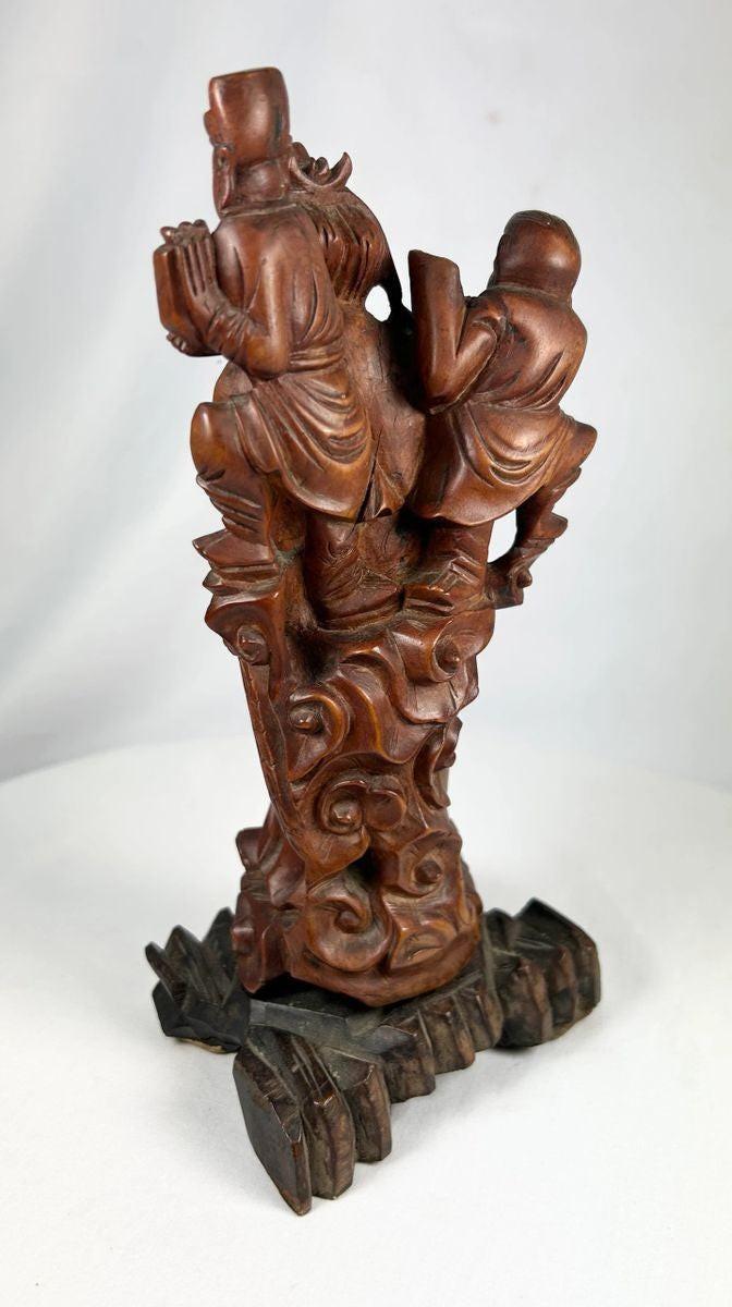 Antique Chinese wood carving depicting religious and cultural artistry