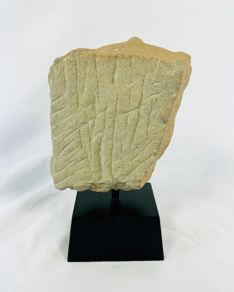 Angkor-period carved stone fragment of Padmapani with serene facial features and flowing contours