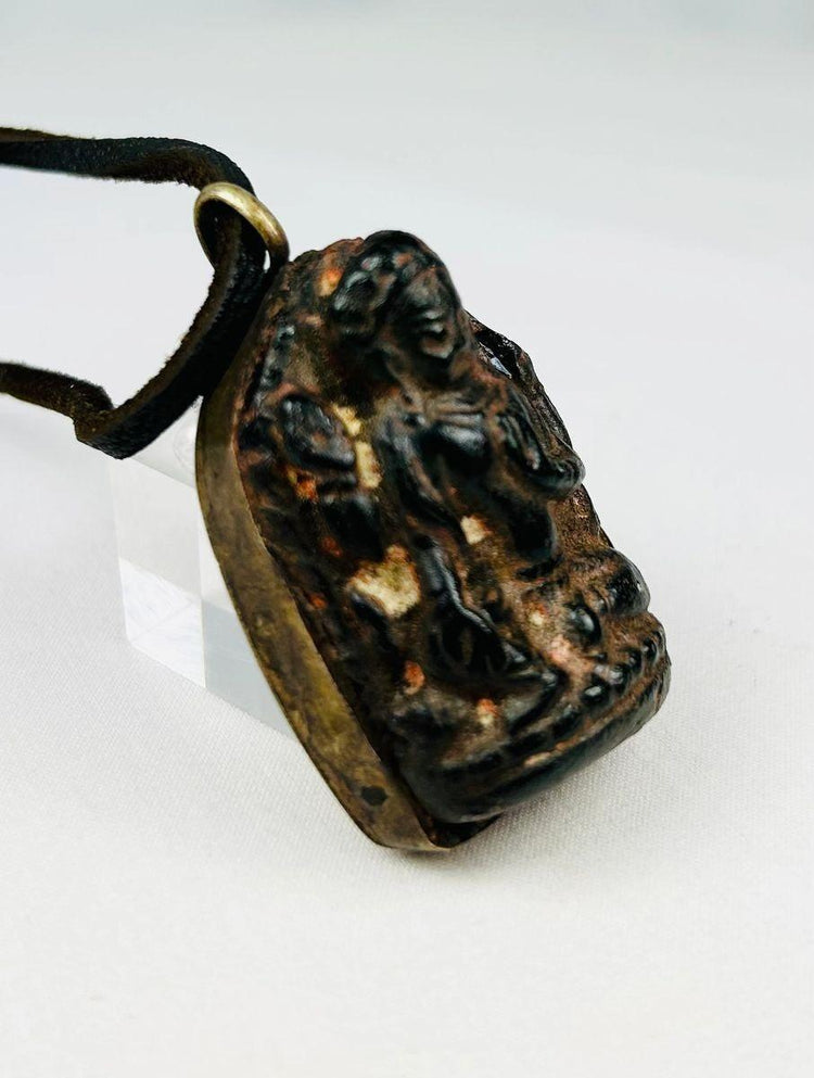 Tibetan/Nepalese bronze devotional amulet with leather cord and patina