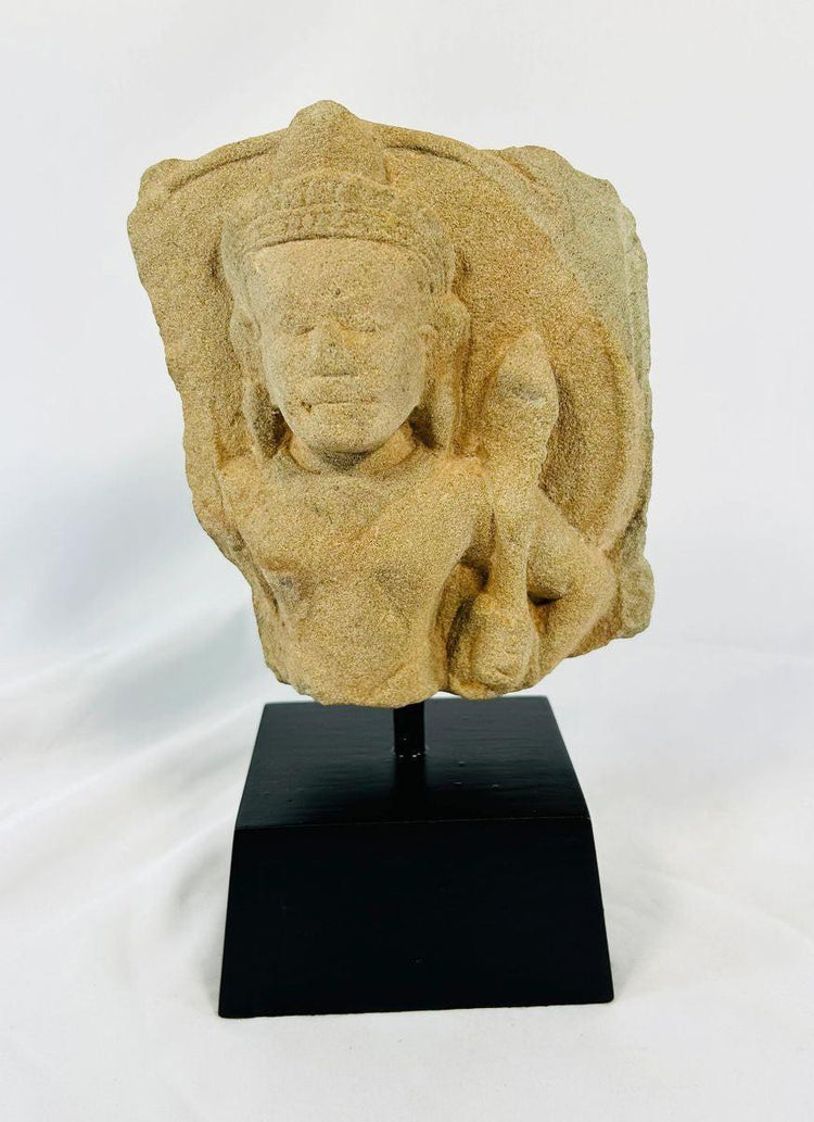 Close-up view of Khmer Empire Padmapani stone carving with natural patina and weathered surface