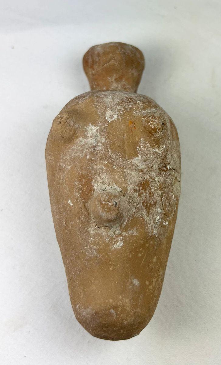 Byzantine terracotta oil lamp with human face spout and aged encrustation