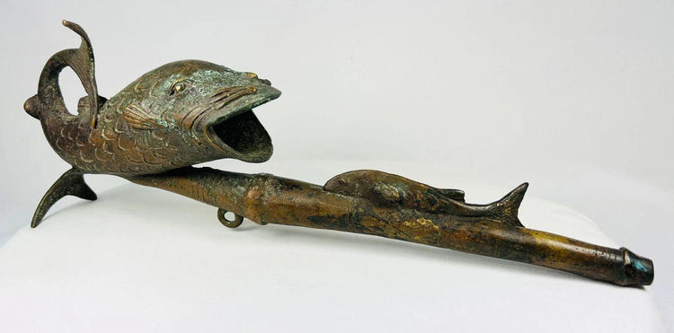 Antique African bronze pipe from Cameroon with fish design and symbolic meaning