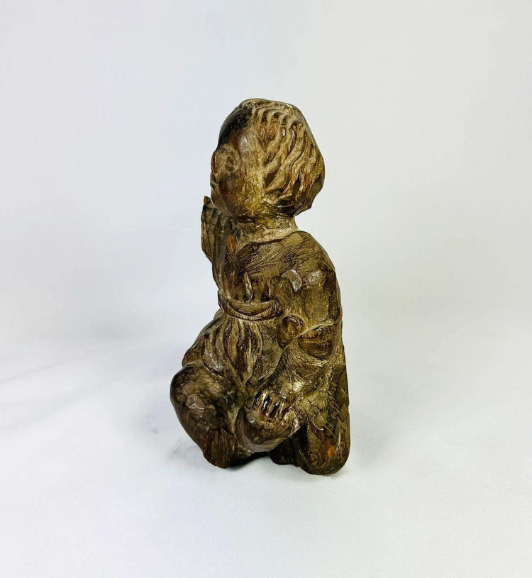 Hand-carved Spanish Colonial religious figurine reflecting spiritual practice