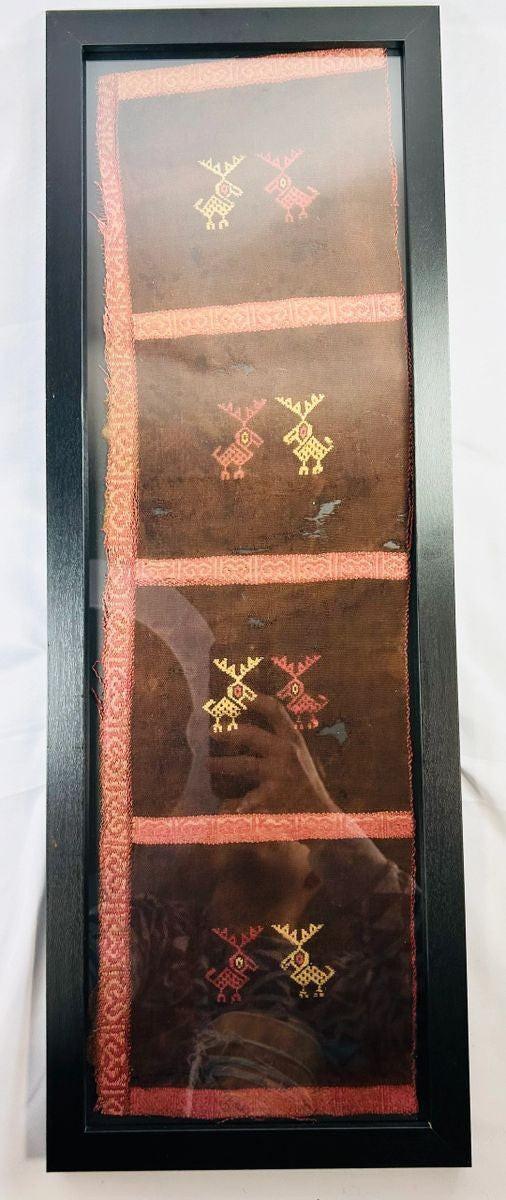 Ancient Andean woven textile featuring stylized animal motifs