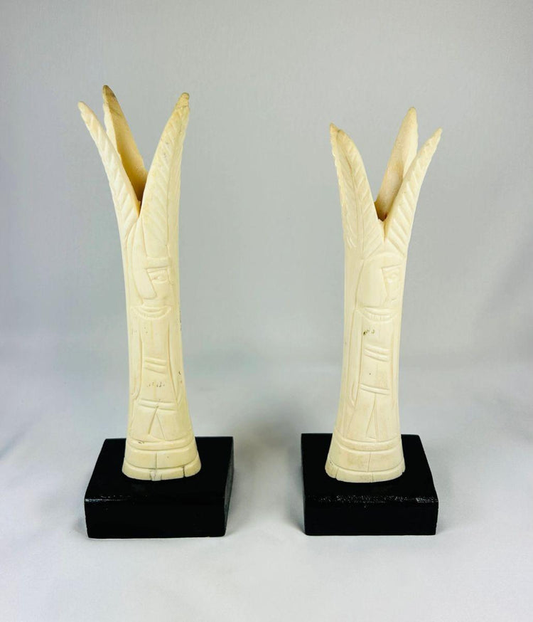 1070–664 BCE Egyptian ivory sistrum handles, Third Intermediate Period, carved stylized figures on display bases