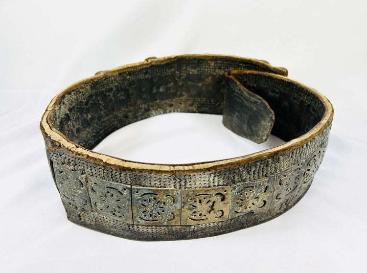 Back view of 17th–18th century Southern Russian Jewish bridal belt made of brass with pierced plates and inset carnelian gemstones.