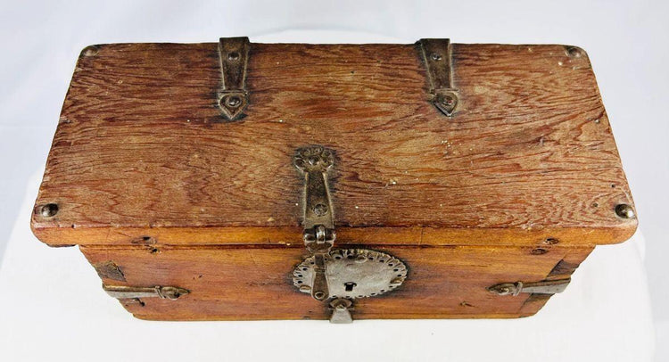 18th–19th century Himalayan wooden lockbox featuring circular iron hasp and ornate key.
