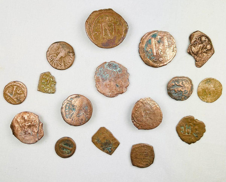 Group of sixteen ancient Roman and Byzantine bronze coins showing varied imperial iconography