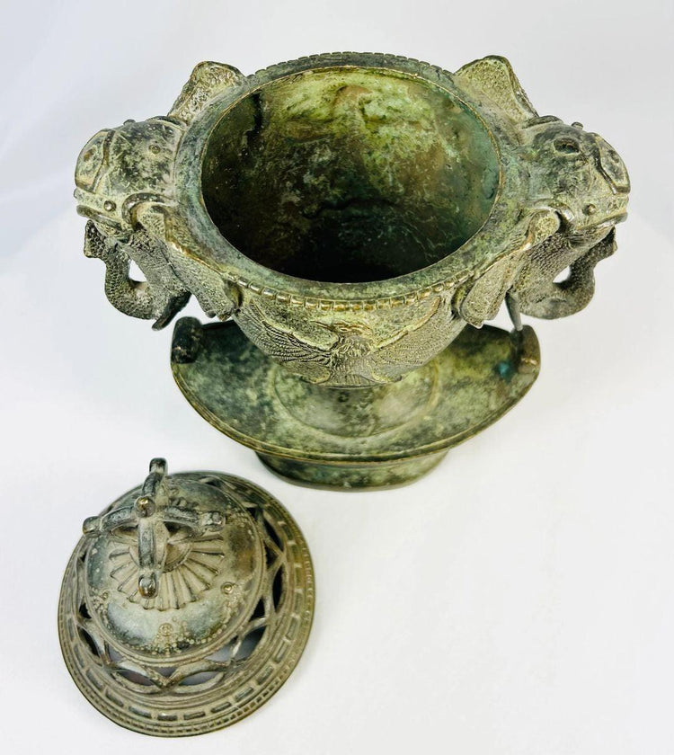 Open-lid view of 18th-century bronze censer displaying interior patina and detached domed lid with vajra finial.