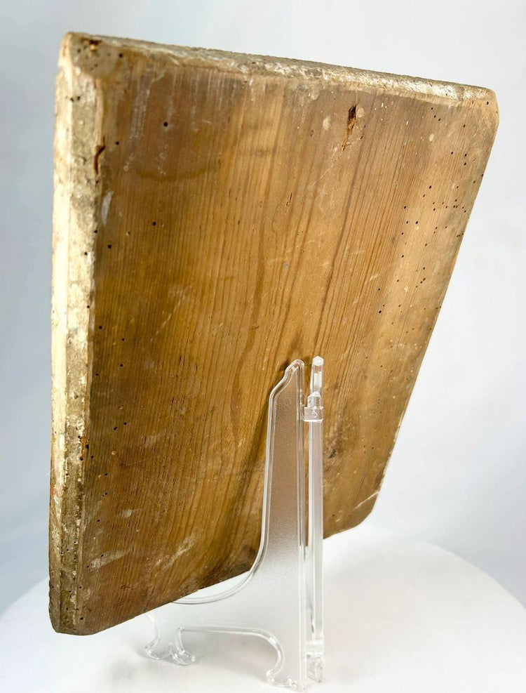 Back angled view of an 18th-century Russian Orthodox icon showing the aged wooden panel with natural wear and historical wormholes.