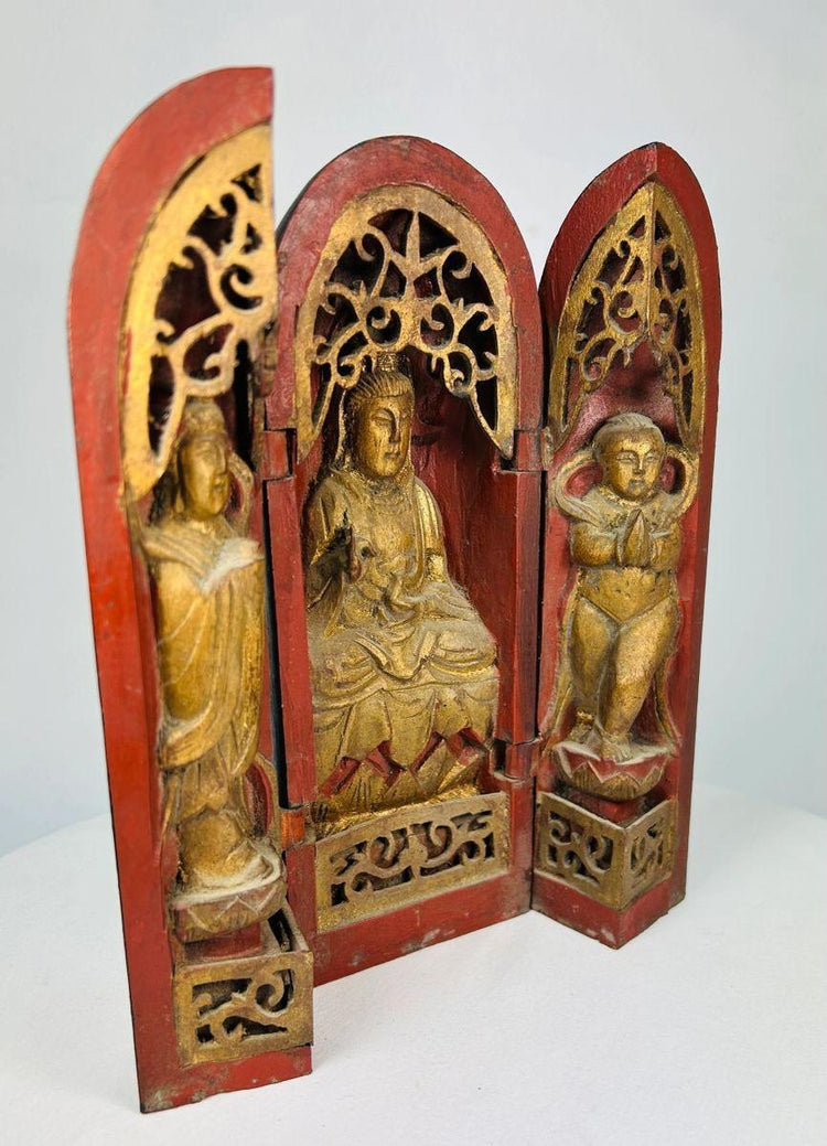 Antique Chinese devotional shrine with floral carvings, aged lacquer, and patina