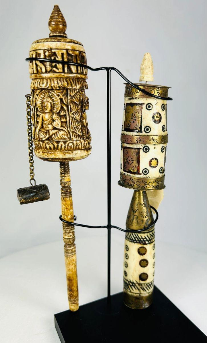 Antique Tibetan prayer wheels symbolizing devotion and spiritual practice