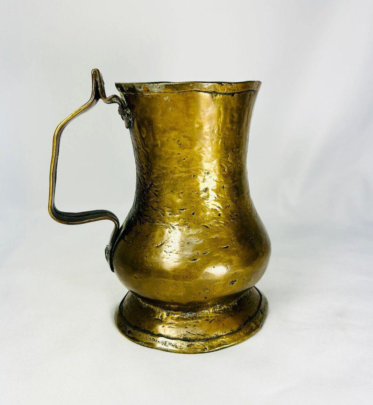 Antique 1700s brass drinkware with natural patina and Georgian design