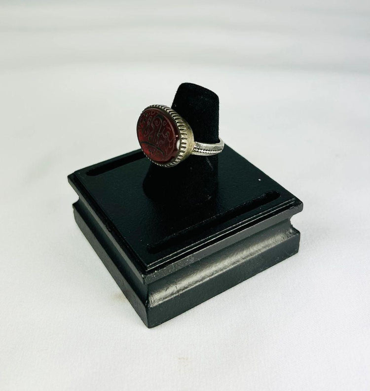 1st millennium BCE carnelian intaglio ring, Ancient Near East, silver bezel, finely detailed animal and symbolic carvings