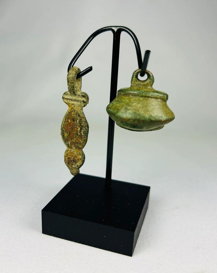 Ancient Roman bronze pendant and bell artifacts, circa 1st–4th century CE