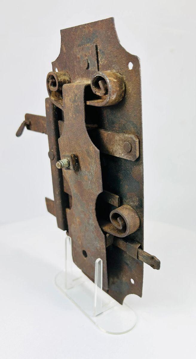 Historic 18th century iron door lock with rectangular form and hand-forged details