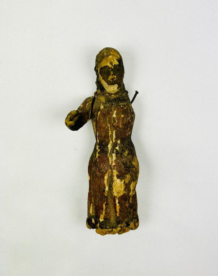 Detail of carved garments and facial features on a Spanish Colonial devotional sculpture