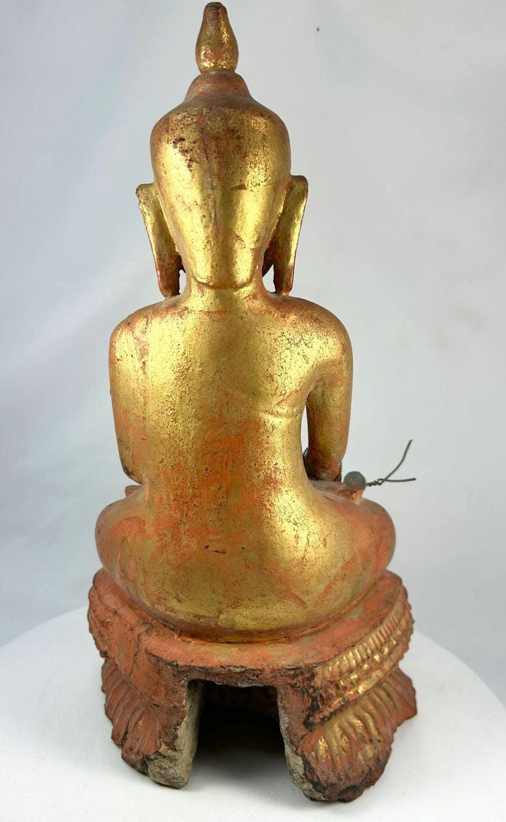 Detail of hand-carved robes on a large antique Burmese Buddhist monk statue