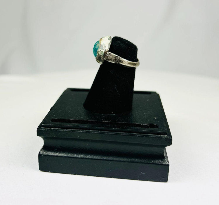 Silver ring featuring engraved horse and rider with raised turquoise bezel from antiquity
