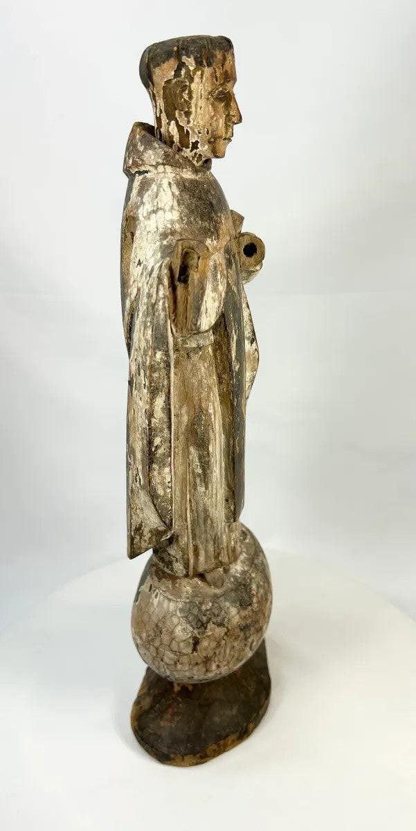 Antique Spanish Colonial santo of a Franciscan or Dominican friar, hand-carved wood with aged gesso and polychrome remnants.