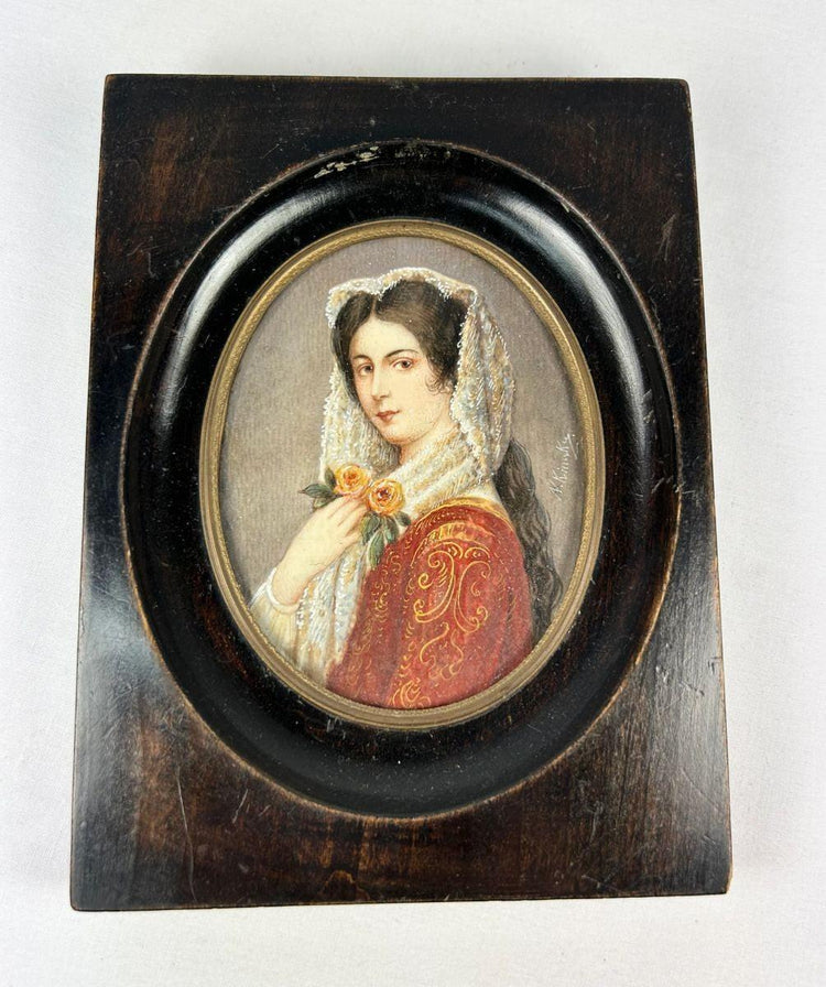 Signed miniature portrait of a woman with roses, gouache on ivory or wafer