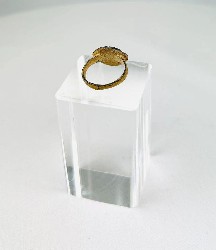 Ancient Roman bronze ring featuring vertical incised decoration and aged green patina