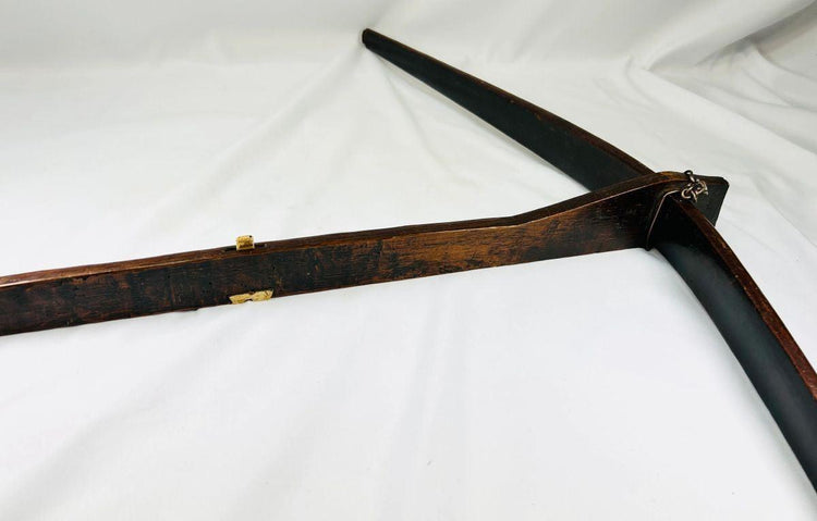 Detailed view of late Qing era Nu minority crossbow showing wood grain and bone fittings.