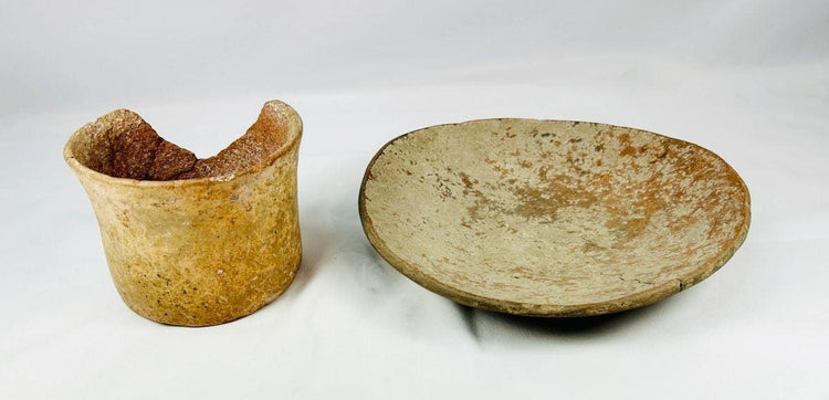Ancient Neolithic pottery from 4000–2000 BCE with earthy tones and patina