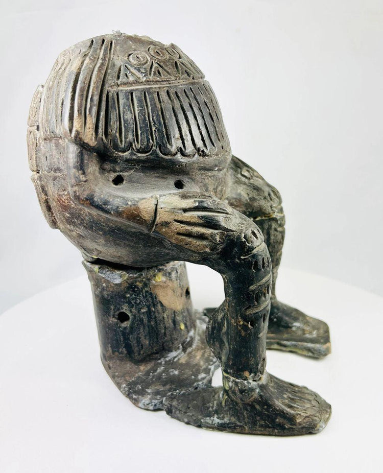 West Mexican terracotta figure with geometric incised motifs and patina