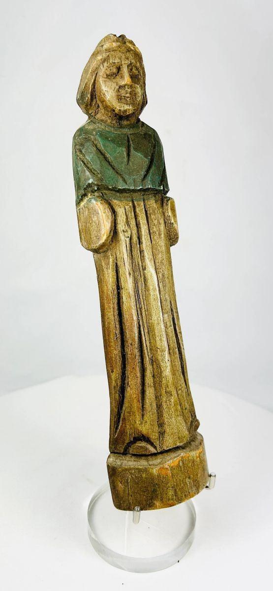 European devotional wooden sculpture displayed on neutral background, showing carving quality.