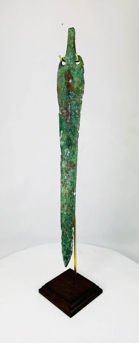 Side view of ancient bronze weapon from Caspian region, early Persian metallurgy, 3000–4000 years old.