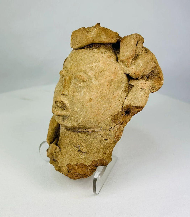 Terracotta ceremonial head fragment from Mesoamerica, side profile photograph